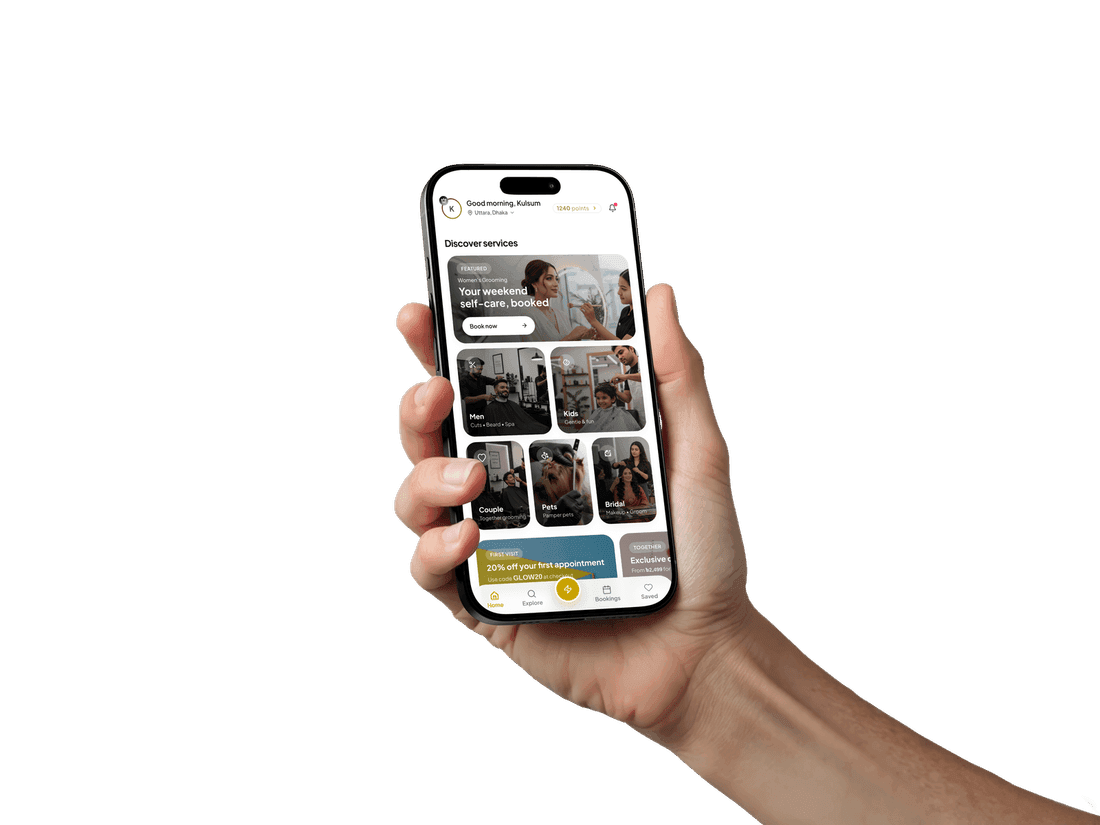 Hand holding a phone showing the GlowHaat home screen